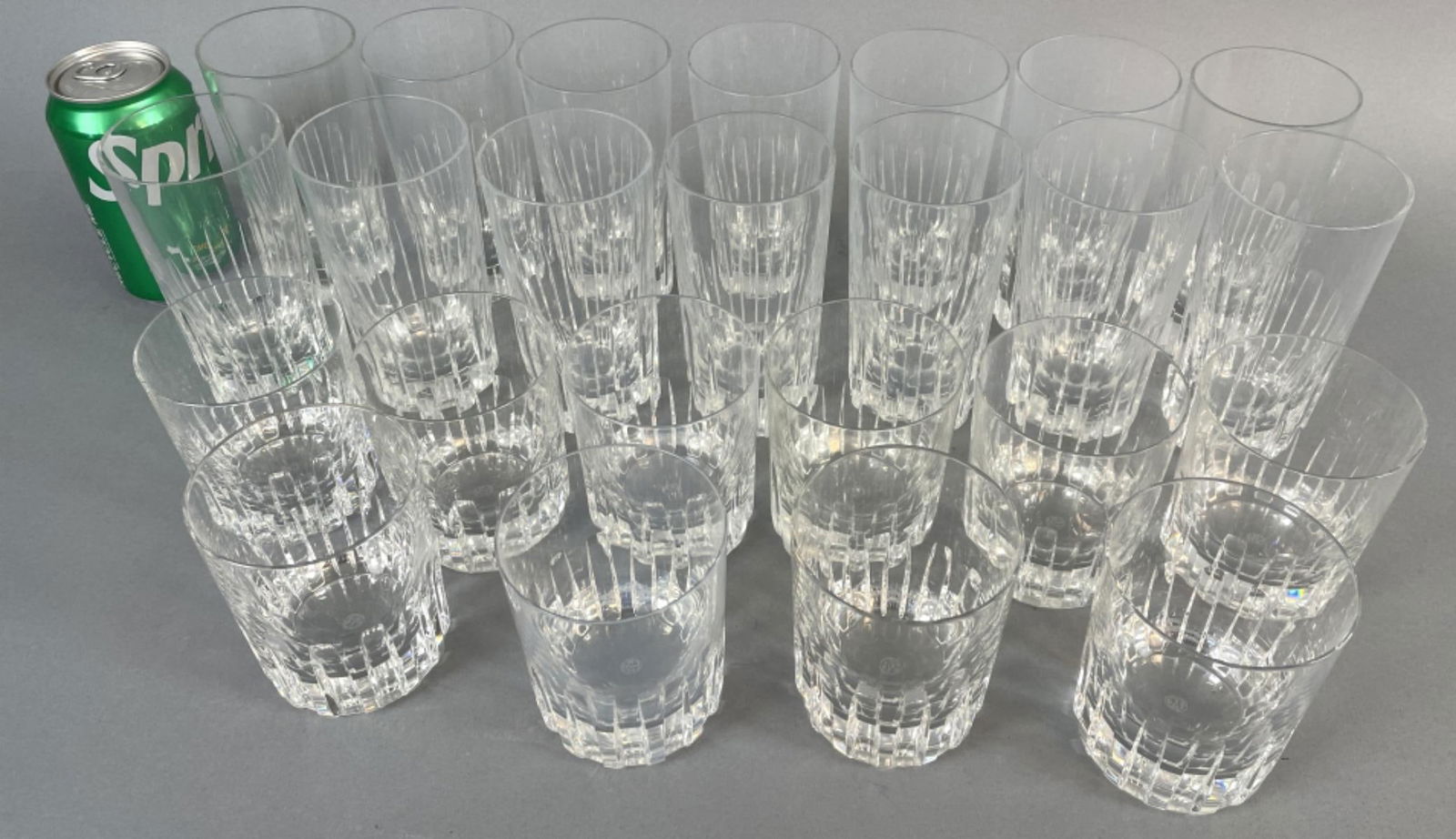 Baccarat Rotary Crystal Glasses: Baccarat Rotary Crystal Glasses. Comprising of: 14 highball 5 1/2"h, 2 rim chips, 4 base chips, one with both 10 tumblers 3 3/4"h, 1 with rim chip Condition: See above.
