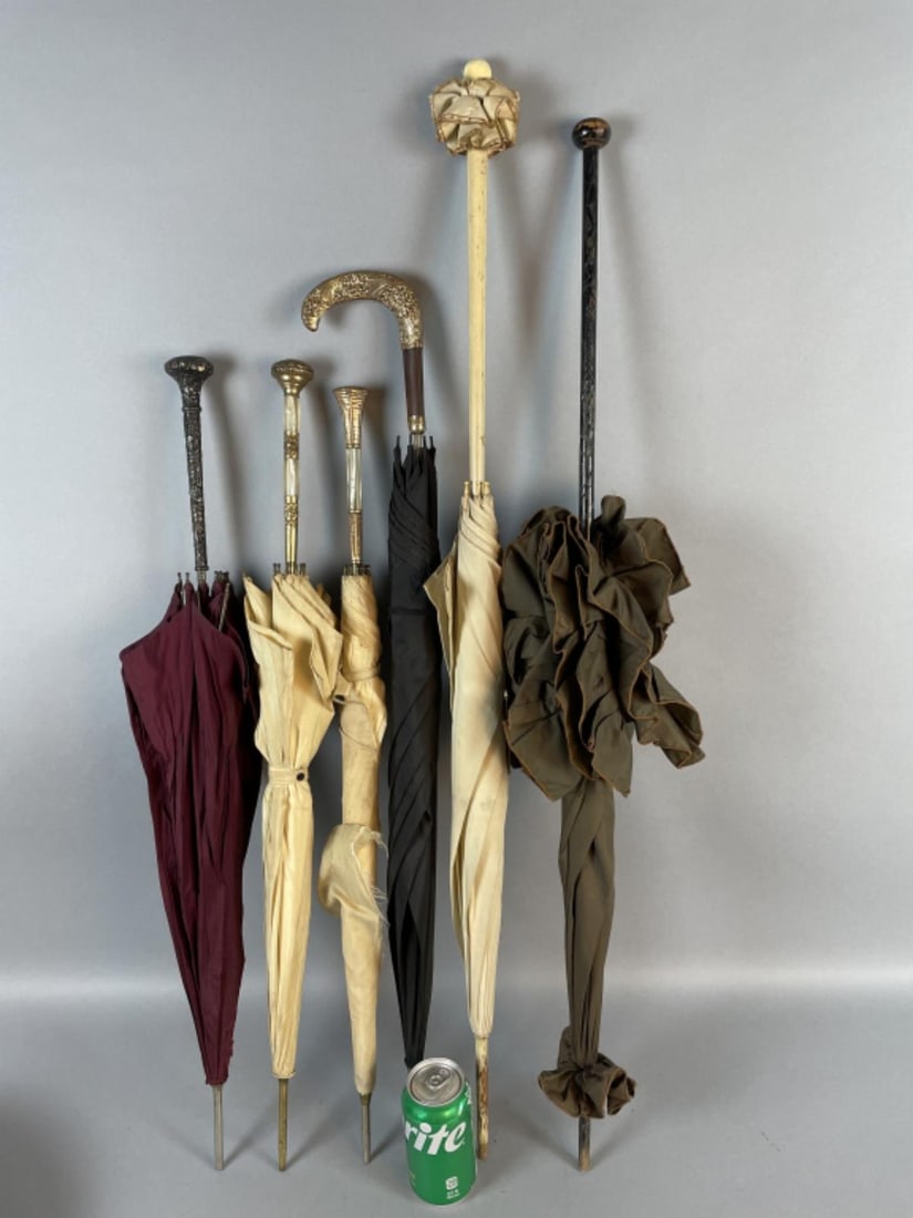 5 Parasols Gold & Mother of Pearl w/ More: 5 Parasols Gold & Mother of Pearl w/ More. Comprising of: 2 Wooden 2 gold & mother of pearl 1 gold 1 silver Tallest: 40 1/2"h Condition: Unopened, wear, 2 missing tip.