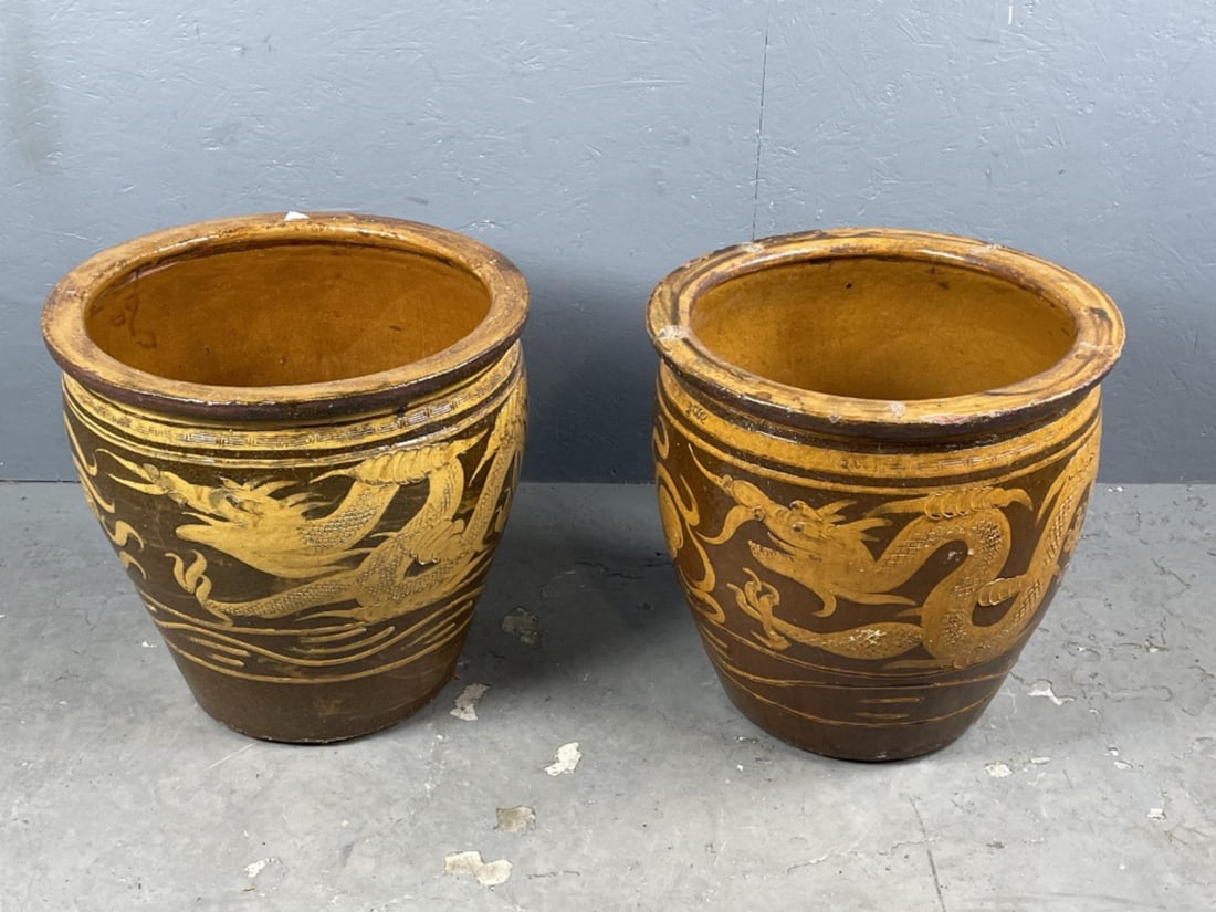 Pair of Chinese Dragon Decorated Planters: Pair of Chinese Dragon Decorated Planters. 19 1/2"h x 20"w Condition: Some wear to glaze, minor chips.
