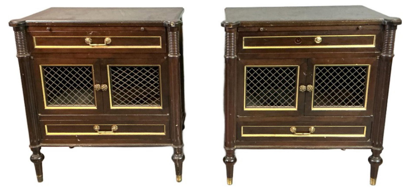 Pair of Louis XVI Style Nightstands: Pair of Louis XVI style nightstands. Pullouts, drawers, and cabinets. Measure 28.25"h x 27"w x 16.25"d. Condition: One nightstand missing handle and piece of hardware, scratches and scuffs.