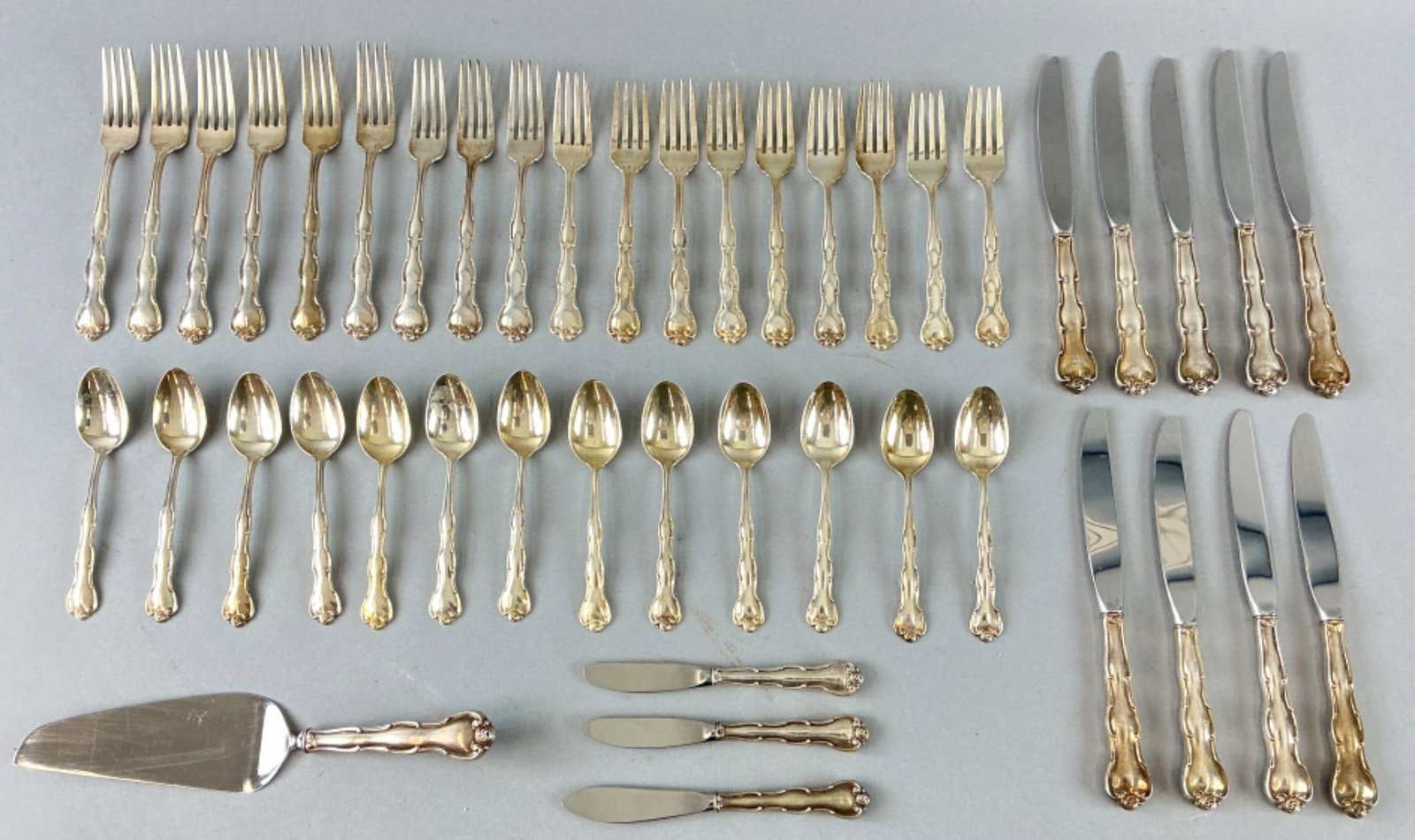 Gorham Rondo Sterling Silver Service: Set of Gorham Rondo pattern sterling silver partial service. Comprised of: 1 server 1 cheese knife 2 butter knives 9 knives 13 spoons 9 dinner forks 9 salad forks All pieces signed and marked sterling