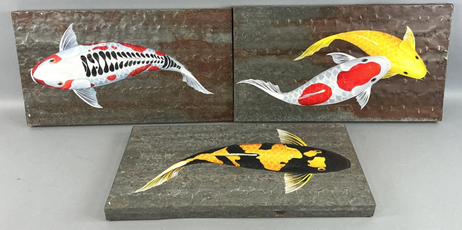 3 Koi Fish Acrylic on Metal Paintings: 3 Koi fish acrylic on metal sheet paintings. Largest measures 13.25"h x 23.75?w. Condition: Some patina, rust, holes on sheets.