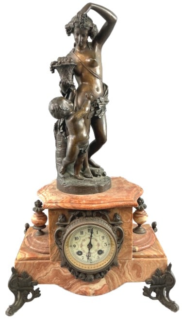 Bacchante Bronze Patinated Marble Mantel Clock: 19th Century French red marble and bronze patinated mantel clock. After Edmond Leveque (French, 1814-1875), "Bacchante" or "Venus with Putto." Measures 21.5"h x 12.75"w x 7.5"d. Condition: Untested. C