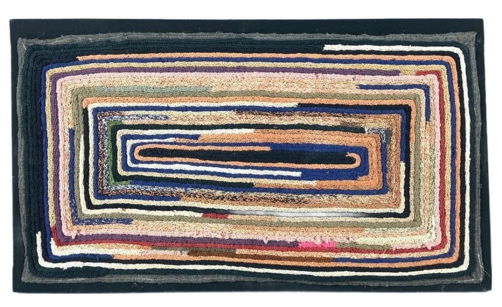 American Folk Art Hand Hooked Rug: American folk art hand hooked rug mounted on fabric. Multicolor geometric pattern. Measures 16"h x 28"w (mounted). Condition: Pulling.
