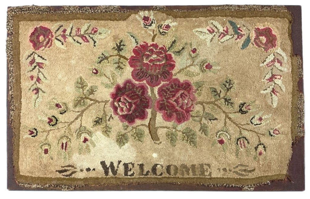 Antique Hand Hooked Floral Welcome Rug: Antique hand hooked rug mounted on canvas. "Welcome" with floral design. Measures 24.25"h. 38.75"w (mounted). Condition: Discoloration, losses.