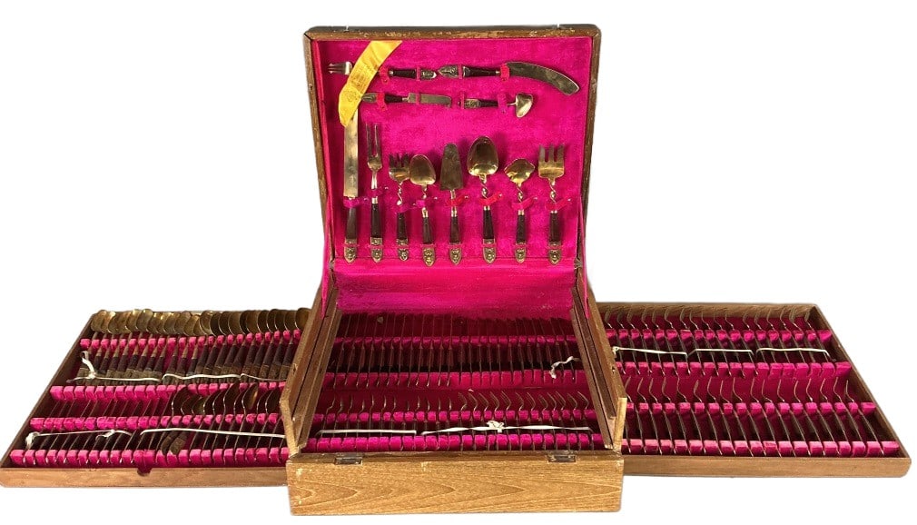 Vintage Thai Brass Flatware Set: Vintage Thai brass flatware set with storage box. Comprised of: 12 pieces serving utensils. 36 knives. 48 spoons. 48 forks. Largest piece measures 12"l. Condition: Needs polishing. Some scratches, ben