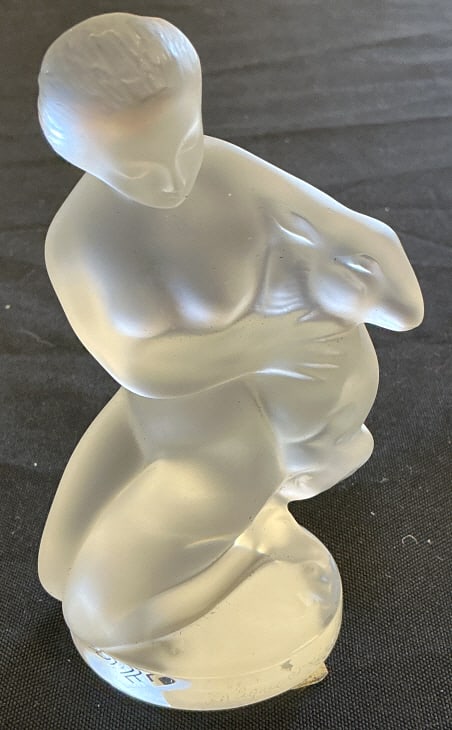 Lalique Diana The Huntress Crystal Figurine: Lalique crystal figurine. Diana The Huntress. Satin finish crystal. Includes box. Measures 4.5"h x 2.5"w x 2.5"d. Condition: Good.