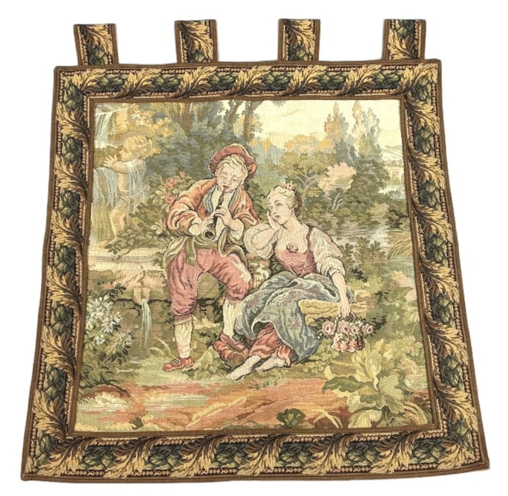 Pastoral Romance Scene Tapestry: Wall tapestry with pastoral romantic scene. Measures 23.5"l x 23"w. Condition: Some fading.