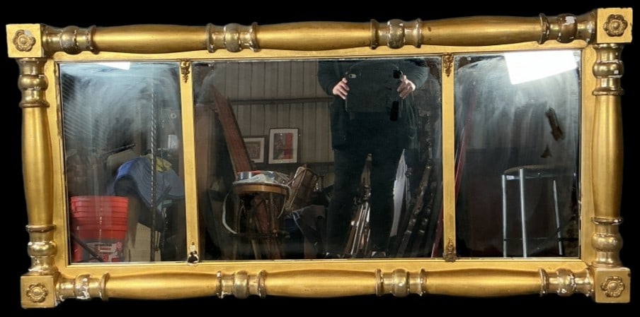 Empire Style classical Giltwood Mirror: Empire style classical giltwood mirror. Measures 26.25"h x 55.75"w. Condition: Scratches, some loss to paint and wood.