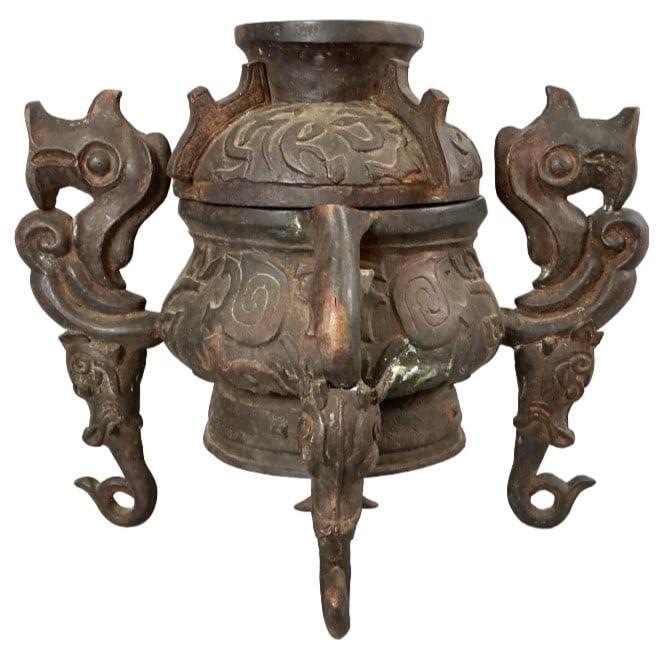 Asian Bronze Patina Dragon Incense Burner: Asian bronze patinated brass incense burner with dragon motif feet. Measures 24.5"h x 17"w x 15"d. Condition: One leg needs repair. Some dents and scratches.