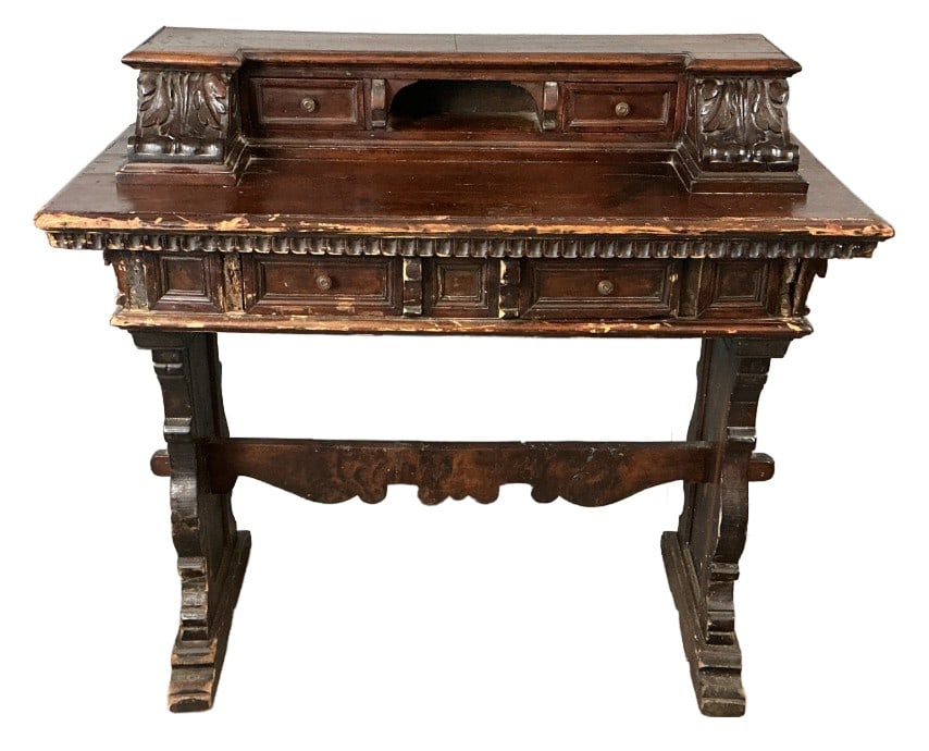 Baroque Style Writing Desk with Gallery: Baroque style carved wood writing desk with gallery. Measures 47.5"h x 42.25"w x 20"d. Condition: Scratches, scuffs, loss to some wood and finish. Base needs tightening. Old repairs.