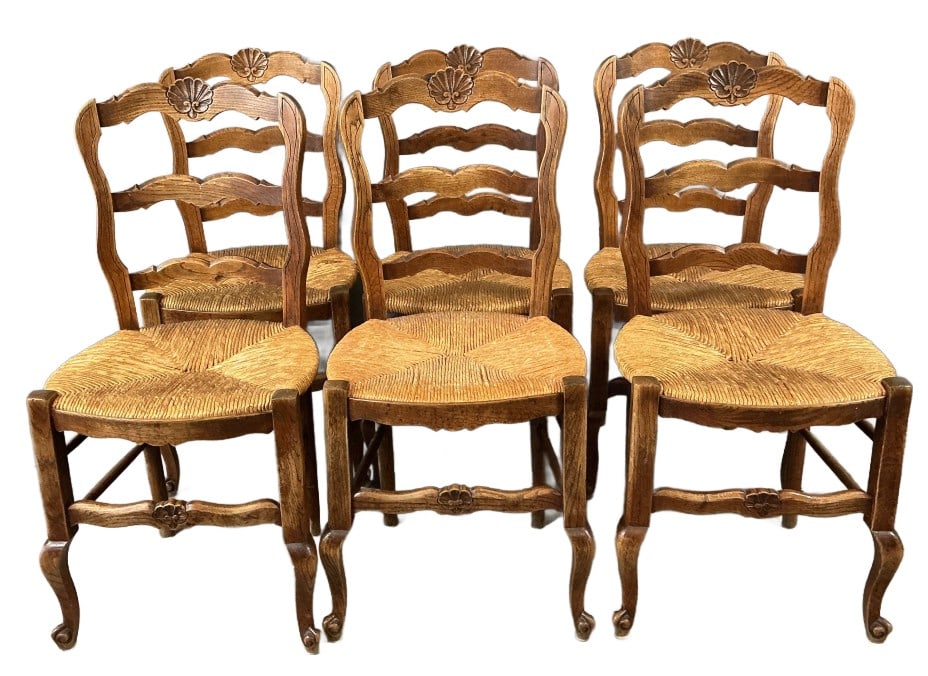 Set of 6 Winchester Oak Ladder Back Chairs: Set of 6 Winchester oak ladder back chairs with rush seats. Measures 35.5"h x 17.5"w x 17"d. Condition: Some worn and broken straw.