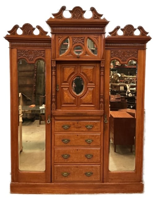 Victorian Walnut Highly Carved Armoire: Victorian walnut highly carved armoire. Comes in 7 pieces for easy movement. Measures 134.5"h x 70"w x 20"d. Condition: Some scratches and scuffs, some general wear.