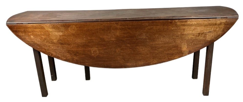 Georgian Style Irish Mahogany Wake Table: Georgian style Irish mahogany wake table. Drop leaf. Measures 30"h x 78"w x 17"d (folded), 49"d (extended). Condition: Wear to finish, stains, scratches and scuffs.
