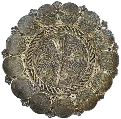 Vintage Silver Filigree Floral Footed Dish: Vintage silver footed dish with intricate filigree and floral design. Tested for silver, purity unknown. Measures 1"h x 6.75"dia. Weight: 6.40 troy ounces. Condition: Patina, a couple of breaks to