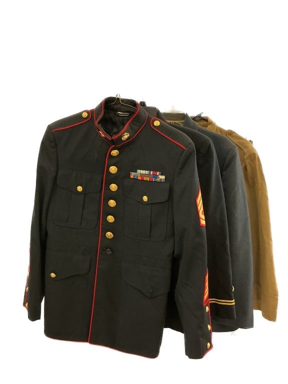 Grouping of WWII & Vietnam US Military Uniforms: Grouping of World War II and Vietnam War era US Military uniforms. Comprised of: 2 Vietnam War era US Marine Corps dress uniforms. World War II US navy jacket. 2 other military jackets. Condition: Som