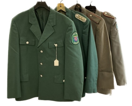 4 Cold War Era German Police & Military Uniforms: Grouping of German Cold War era police and military uniforms. Comprised of: 2 German police tunics. 2 German military tunics. Condition: Some age related wear to all pieces. Small holes/tears, stains,