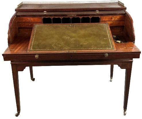 Georgian Mahogany Tambour Wood Desk: Georgian mahogany tambour wood desk. Leather top, pull out. On casters. Measures 40.5"h x 43?w x 25.5?d. Condition: Some missing wood, scratches and scuffs.
