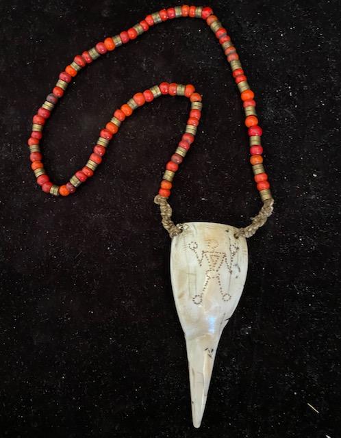 Bone and Coral Necklace carved figure Naga: Naga Bone and Coral necklace has hand etched figural in bone. Pendant size is 4.5" long. Necklace is approximately 21. FREE DOMESTIC SHIPPING.
