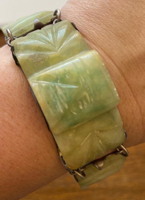 Mexican Jadeite Bracelet sterling: Mexican carved jadeite bracelet. Jadeite is carved with face figures. Mexican Silver. Bracelet measures 7". FREE DOMESTIC SHIPPING.