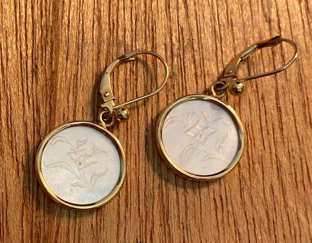 14k and Mother of Pearl earrings: 14k gold and Mother of Pearl earrings. Mother of pearl dangle is etched with a nice floral design that is different on front and back. Earrings are light and dainty. Total earring size is 1 3/4 inch, 