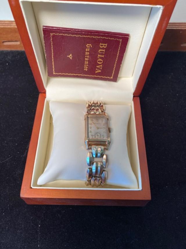 Bulova Woman watch 10K Gold: Bulova women's watch # 7715699 in cardboard original box. 10K gold filled. Personal engraving on back. Purchased in 1947. Face measures 1 inch. Band and face measure 2.25 diameter. FREE DOMESTIC SHIPP