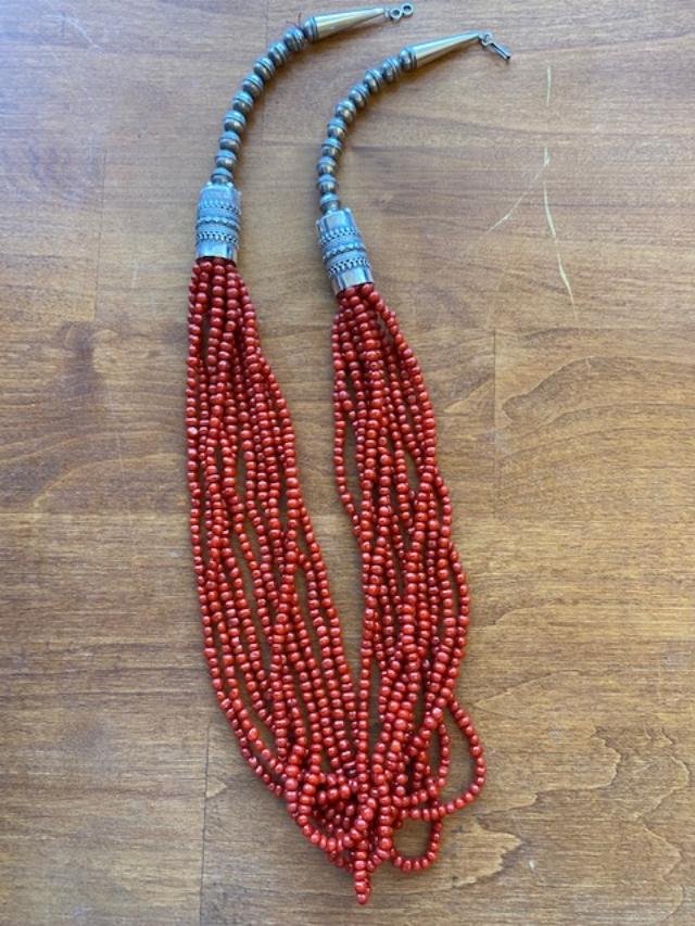 Native American Coral/Sterling Necklace: 10 strand coral and stamped sterling necklace. Deep red coral. Total length 25". FREE DOMESTIC SHIPPING.