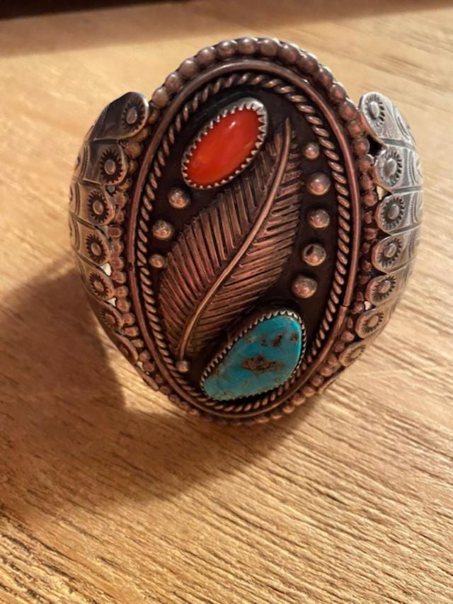 Native American Navajo Turquoise & Coral Cuff Bracelet: Wonderful cuff bracelet featuring turquoise and coral stones in a leaf design. Signed "R." Ca 1960's Cuff opening is 1." 2.25" diameter, approximate 3" width, 3.1 ounces, tested sterling. FREE DOMESTI