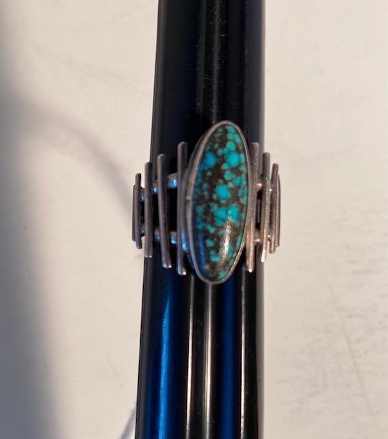 Unusual Signed Navajo Ring: This is an interesting Native American Indian sterling and turquoise ring. Stone has a lovely blue color with veining set in an interesting geometric pattern. Stamped sterling and signed BB Ring size 