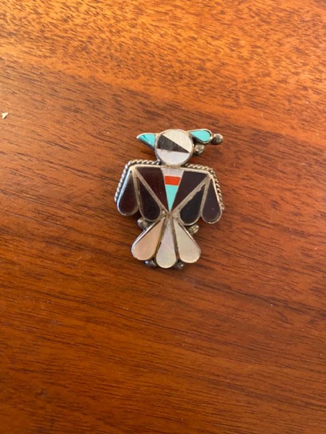 Native American Zuni Thunderbird Pin/Pendant: Native American Zuni thunderbird shape pin. Unsigned. Could also be worn as a pendant. Mother of Pearl, turquoise, coral and onyx. Measures 1.5 inches by 1.25 inches. FREE DOMESTIC SHIPPING.