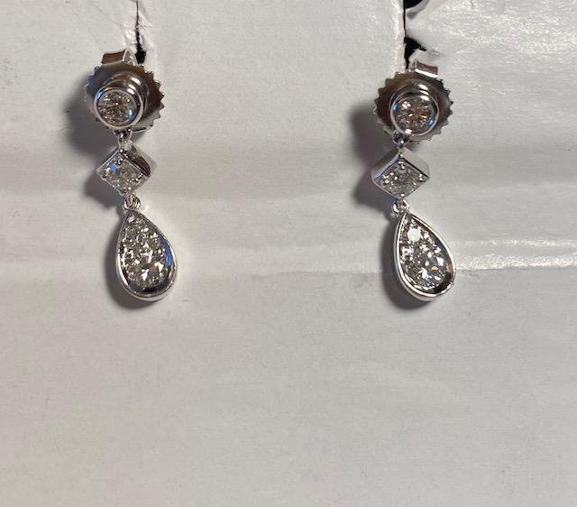Beautiful 18k White Gold Earrings: Stunning 18k (stamped) white gold earrings with diamond like stones. Other stamps include 8G, 4 on 1 and 6 on other, and 074. Measures .75 inch and weighs 3/4 inch. FREE DOMESTIC SHIPPING.
