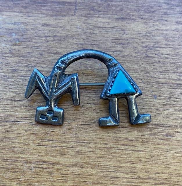 ZUNI Native American Bent Rainbow Man: Native American sterling bent rainbow man sand cast pin with turquoise piece. Measures 1.5 inches. FREE DOMESTIC SHIPPING.