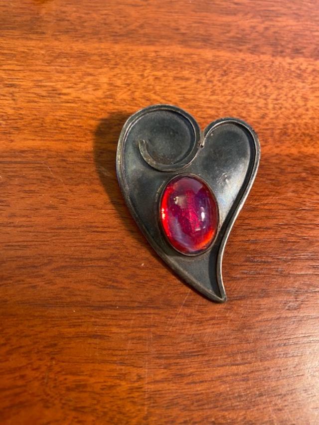 Sterling Silver Pendant/Pinback Israel: Stamped sterling heart pinback or pendant with center pink stone. Made in Israel. Total weight is 10 grams. FREE DOMESTIC SHIPPING.