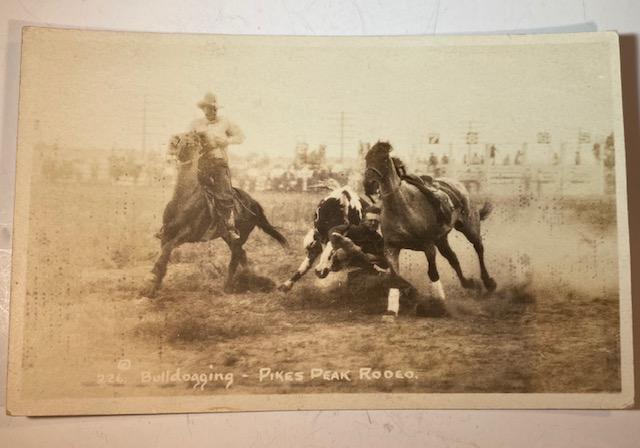 RPPC 1910-1920 Rodeo Round-up Photo Cowboy: Bulldogging Pikes Peak Rodeo. Real Photograph Post Card Rodeo, Round-up, Bucking Bronco, photos by R.R. Doubleday and others. Circa 1910s- 1920s. FREE DOMESTIC SHIPPING