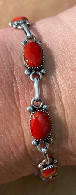 Native American Navajo Coral and Sterling Bracelet: Native American Indian sterling silver and coral clasp bracelet. Signed RLD. Bracelet measures 7". FREE DOMESTIC SHIPPING
