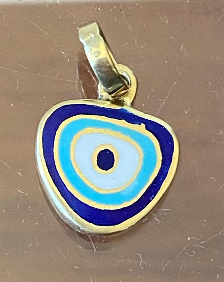 14k Gold Evil Eye Pendant: Stamped 14k gold evil eye pendant. Quarter for size, approximately 1.1 grams. FREE DOMESTIC SHIPPING