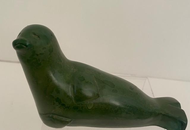 Canadian Inuit Tribe Carved Stone Seal: Canadian Native American Inuit Tribe stone craft seal. Dark green in color. 2.5"x4" $5 DOMESTIC SHIPPING