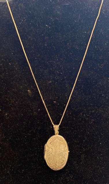 Sterling Silver Chain And Locket: Sterling chain and locket. Circa 1930. Locket opens. Chain measures 22" and locket measures 1.5". Total weight is 11.8g $6.00 DOMESTIC SHIPPING.