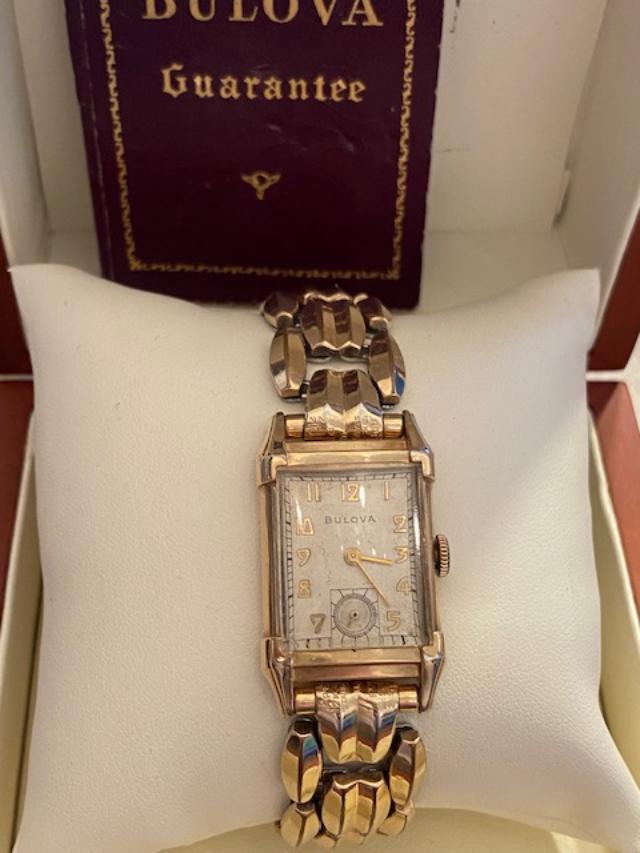 10K Gold Filled Men's Watch: Official Timepiece of American Airlines, Inc. Men's Bulova watch in original box. Watch face is 10K gold filled, elastic watch band is 12K gold filled. Purchased in 1947. Inscribed on watch back. $10.