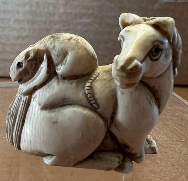 Netsuke Horse and Mouse Carved Pendant Signed: Netsuke carved bone horse and mouse pendant. Measures 1.5" wide by 1" tall. Domestic shipping $6.