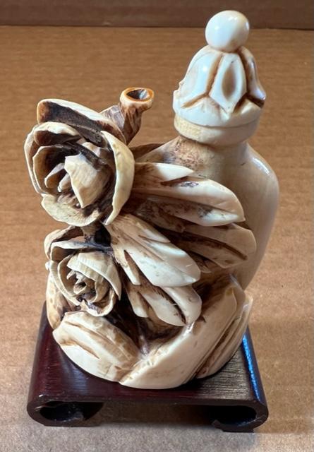 Carved Bone Chinese Snuff Bottle: Carved snuff bottle, bone, on stand. Spoon is wood. Unsigned. Measures 2.75" tall. Domestic shipping $6.