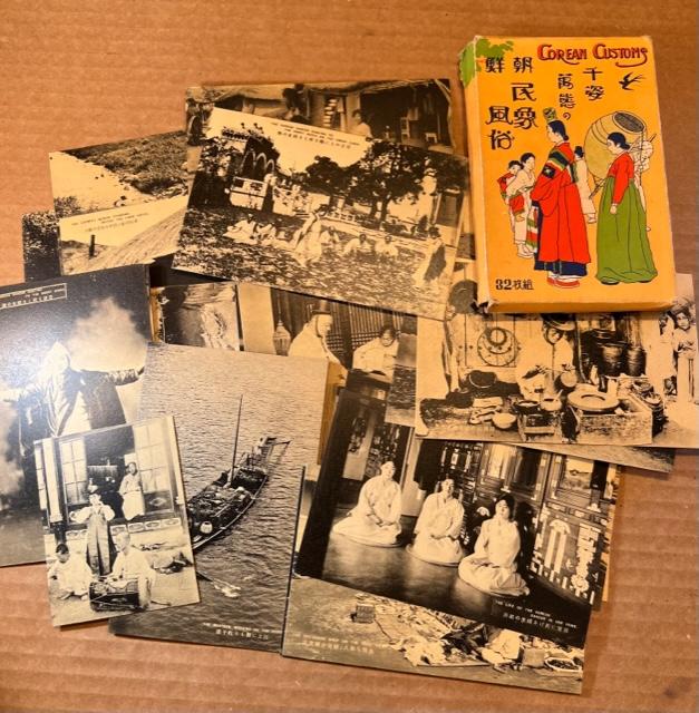 "The Corean (sic) Customs" Printed Postcards: "The Corean (sic) Customs" printed post cards in original box. Box spells Korean with a "C". Post cards spell Korean with a "K". Black and white. Unposted. Looking back to year 1890, Korea was spelled