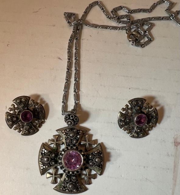 Sterling Silver Vintage Jerusalem Cross Pendant and Earrings: Jerusalem cross pendant and earrings. Cross is marked Jerusalem Jordan. Divided city from 1948-1967. Also marked sterling with pink stone in center. The Clip-on earrings match pendant and are not mark