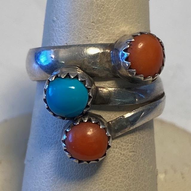 Zuni Coral And Turquoise Ring Signed Coonsis: Native American Zuni turquoise and coral bypass wrap ring. Signed PD Coonsis. Size 6. Domestic shipping $6
