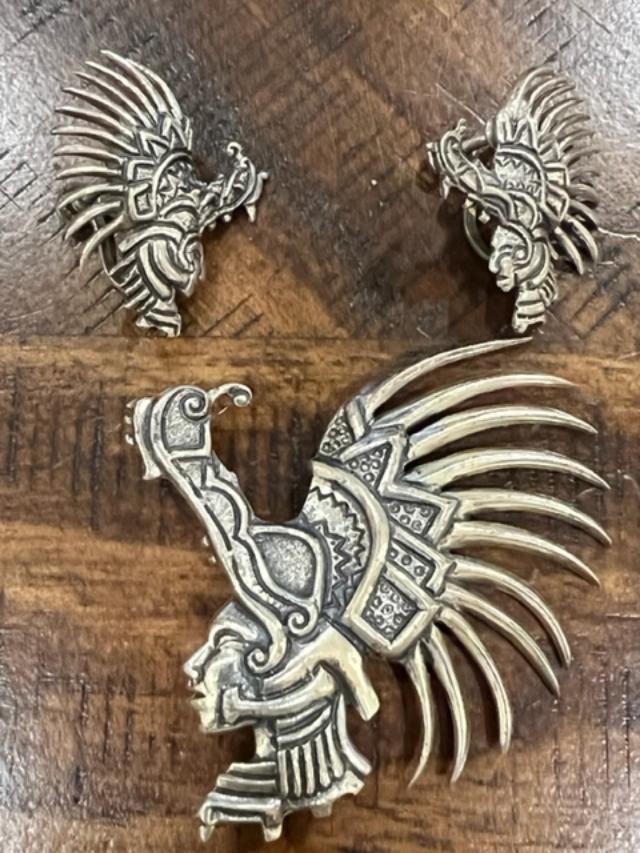 Circa 1950s Tribal Pinback and Earring Set: Unique lot of screwback earrings and pinback, tribal motif, ca. 1950s. Pin 2"x2.5" amd earrings 1"x1.25" Alloy material. Domestic shipping $12