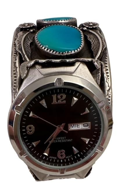 Navajo Sterling Old Pawn Cuff Watch Band Ca 1940: Unmarked sterling cuff watch band with unique offset space for watch face. Etched MP. Cuff opening measures 1.25". Domestic shipping $12. USPS shipping cost only, no additional fees for in-house mater