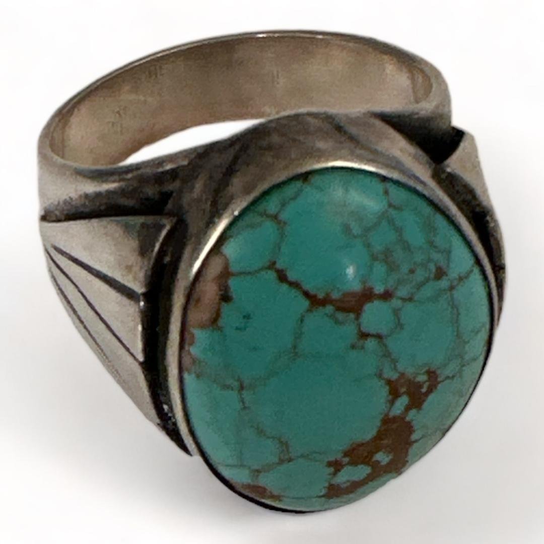 Native American Signed Turquoise Ring: Native American turquoise ring. Worn signature, Unable to decipher. Size 12. Domestic shipping $12. USPS shipping cost only, no additional fees for in-house materials or handling. International shippi