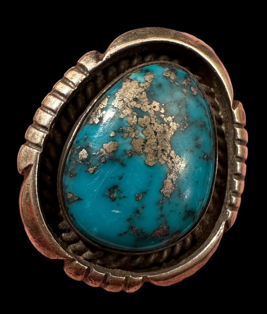 Native American Signed Turquoise Ring: Native American turquoise ring. Silver veining within turquoise chunk. See photos for signature. Unable to decipher. Size 12. Domestic shipping $12. USPS shipping cost only, no additional fees for in-