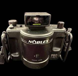 Noblex Pro 6/150 German Panoramic Camera: Noblex German Panoramic camera. Pro 6/150 5 model. Tessar 4.5/50. Has Tamrack strap and working level. No case. Domestic shipping $20. USPS shipping cost only, no additional fees for in-house