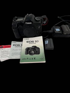 Canon EO-S-5D Camera with Batteries and Charger: Canon EO-S 5D camera body and charger and batteries. With original canon strap and instruction book. Domestic shipping $20. USPS shipping cost only, no additional fees for in-house materials or